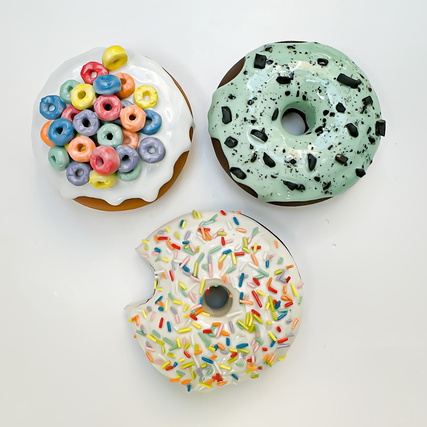 1899 Vanilla Rainbow Sprinkle Ceramic Donut with bite